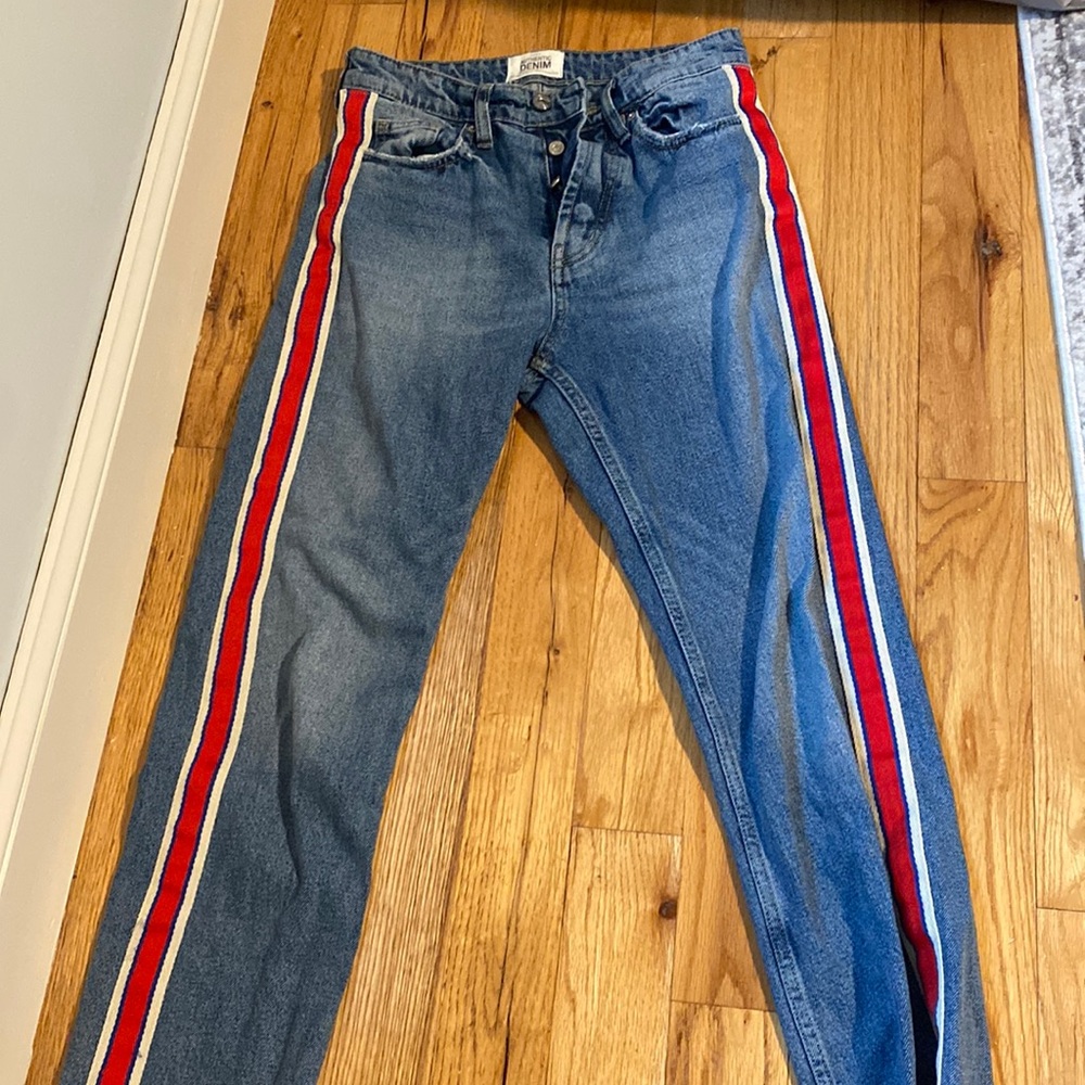 Dark wash jeans with red stripe down the sides